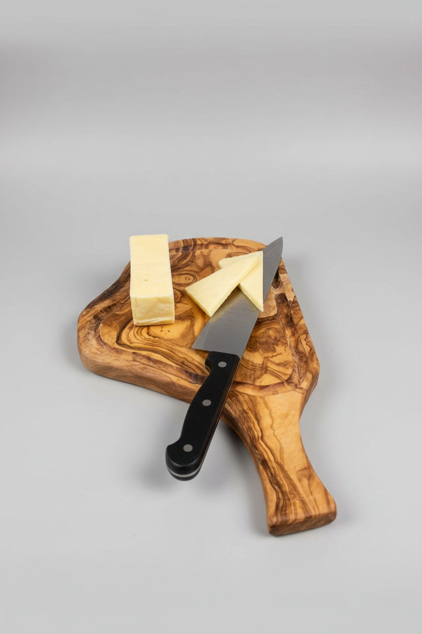 A wooden serving board with a large chef&