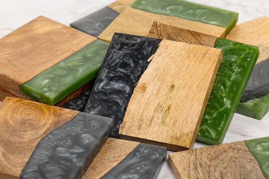 Wooden and green soap bars on a white background