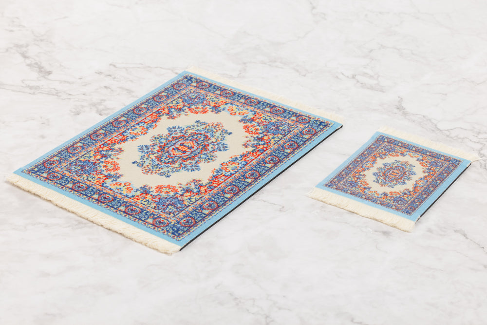 Two decorative rugs with intricate patterns on a light wooden floor.