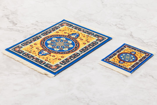 Two decorative tiles with intricate patterns on a white marble surface