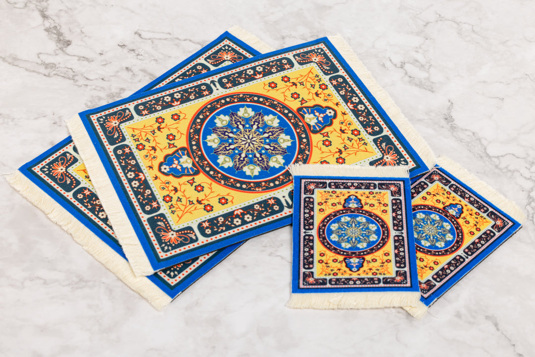 Decorative coasters with geometric patterns on a marble surface