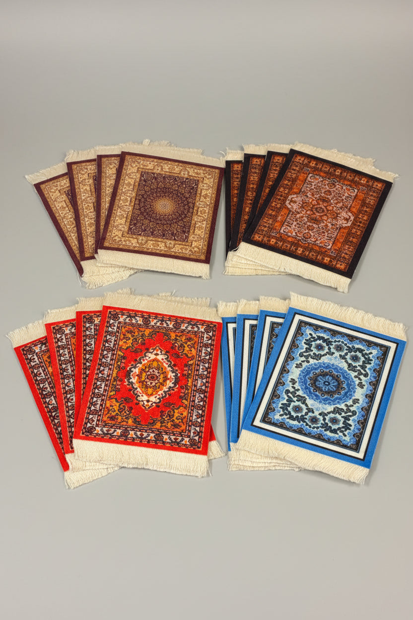 Set of small prayer rugs with different designs on a wooden surface