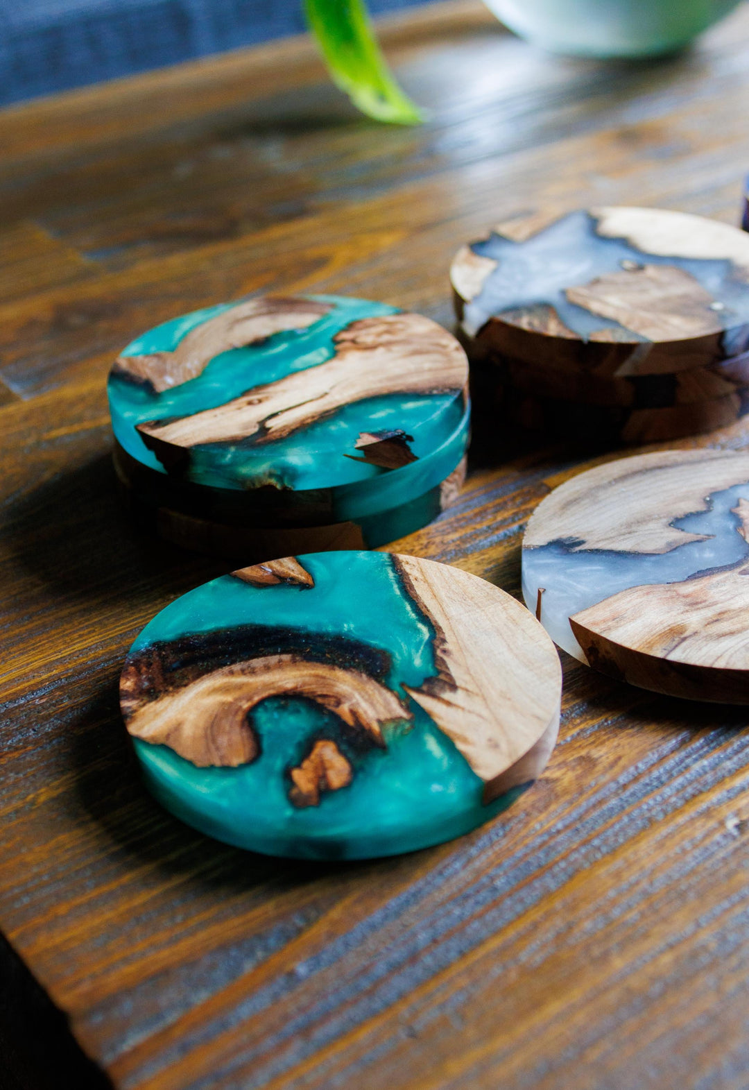 Green resin coasters on a table 