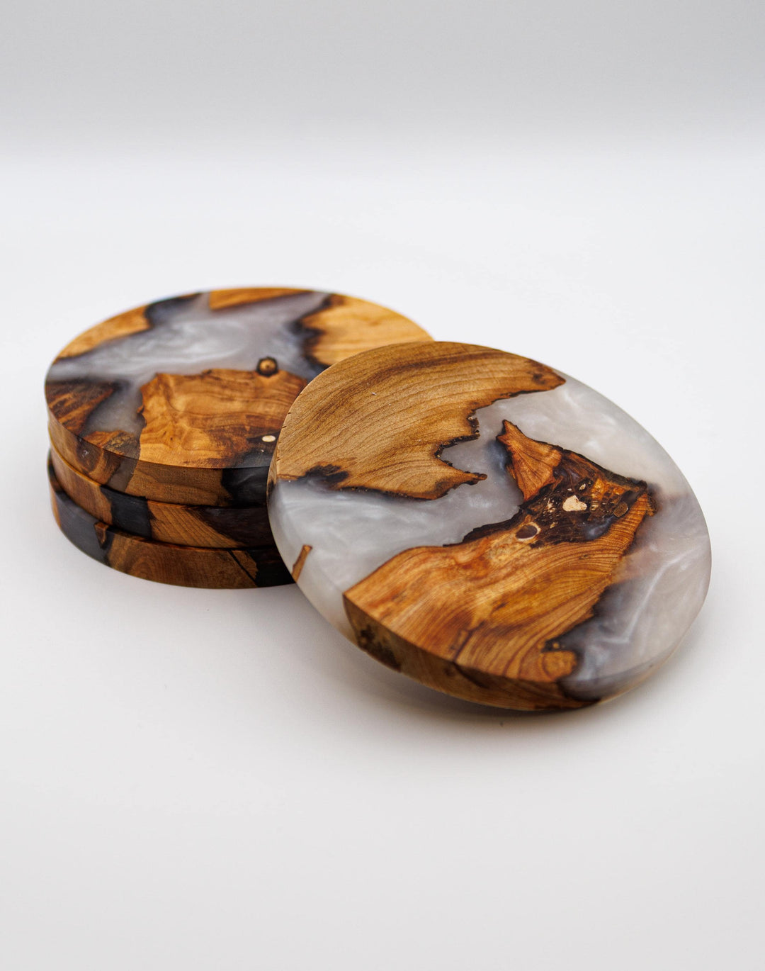 Set of white wood and resin coasters