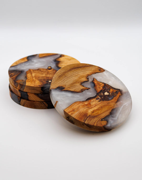 Set of white wood and resin coasters